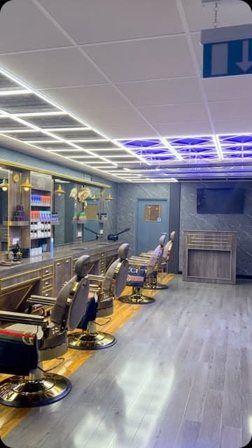 The Nwah Trims shop floor: barber chairs, mirrors and product shelves at Hadley District Centre