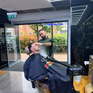 Barber at work by the front windows